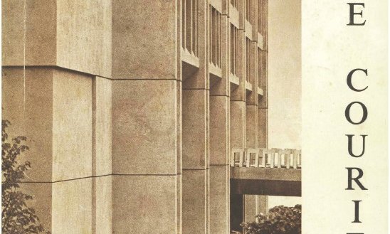 exterior of building with bridge/walkway from 2nd floor to promenade