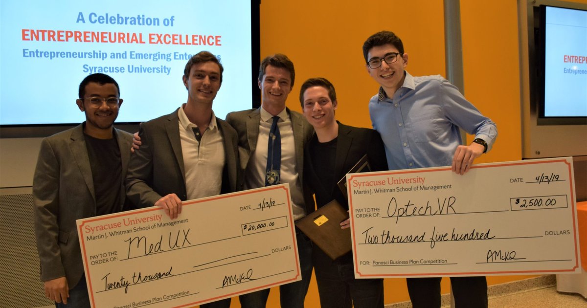 Panasci winners holding oversized check