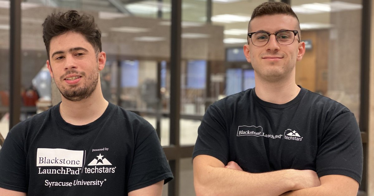 Team members of Promptous in black shirt pose for a photo