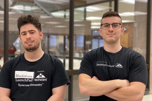 Team members of Promptous Phil Mcknight and Josh Jackson pose for a photo