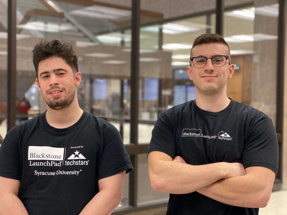 Team members of Promptous Phil Mcknight and Josh Jackson pose for a photo