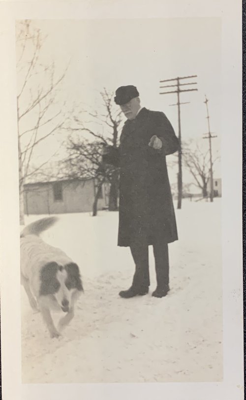 Photograph of the collie playing with Rev. J.B. Felt on a wintery day. “Scotty” Collection.