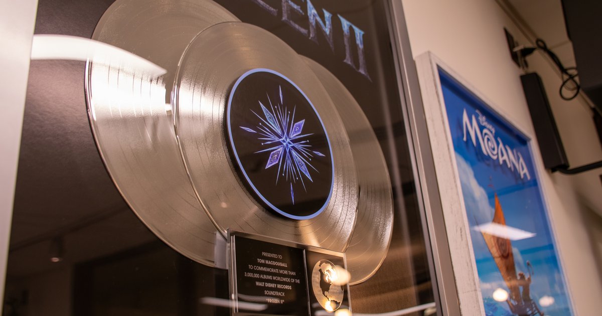 two framed plaques holding platinum records