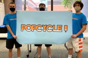 students with a popcycle banner
