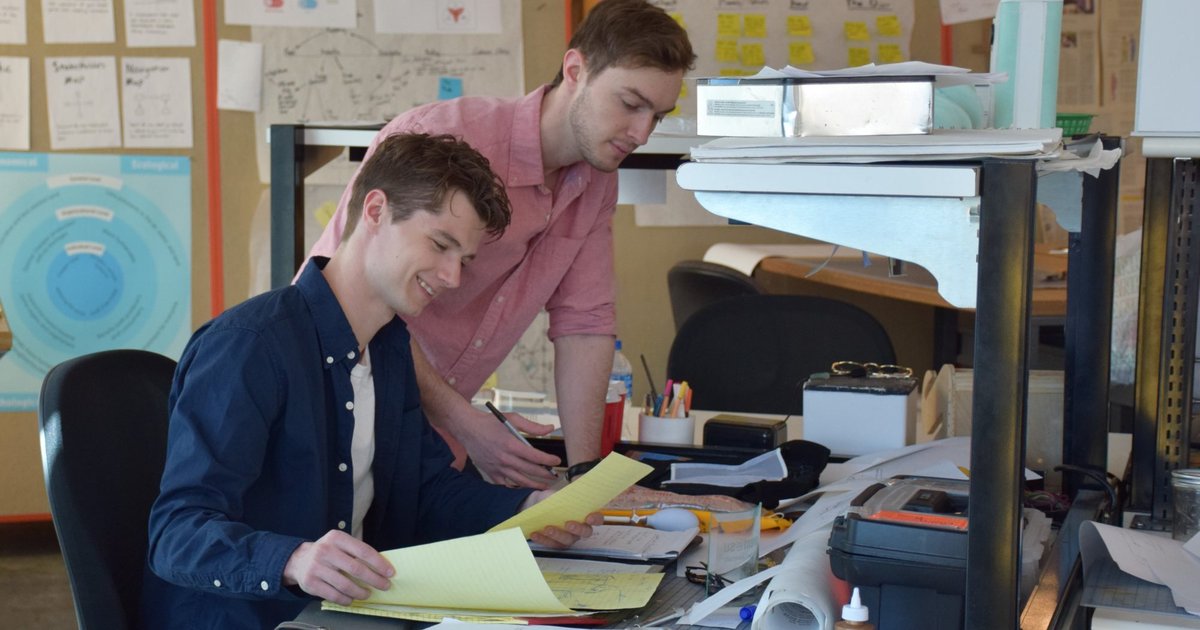 Two students working in SU design studio