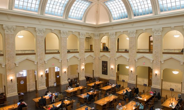 Carnegie Library reading room with large wooden tables