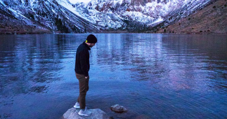 man stand on a rock