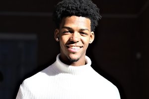 Student in a white turtleneck sweater