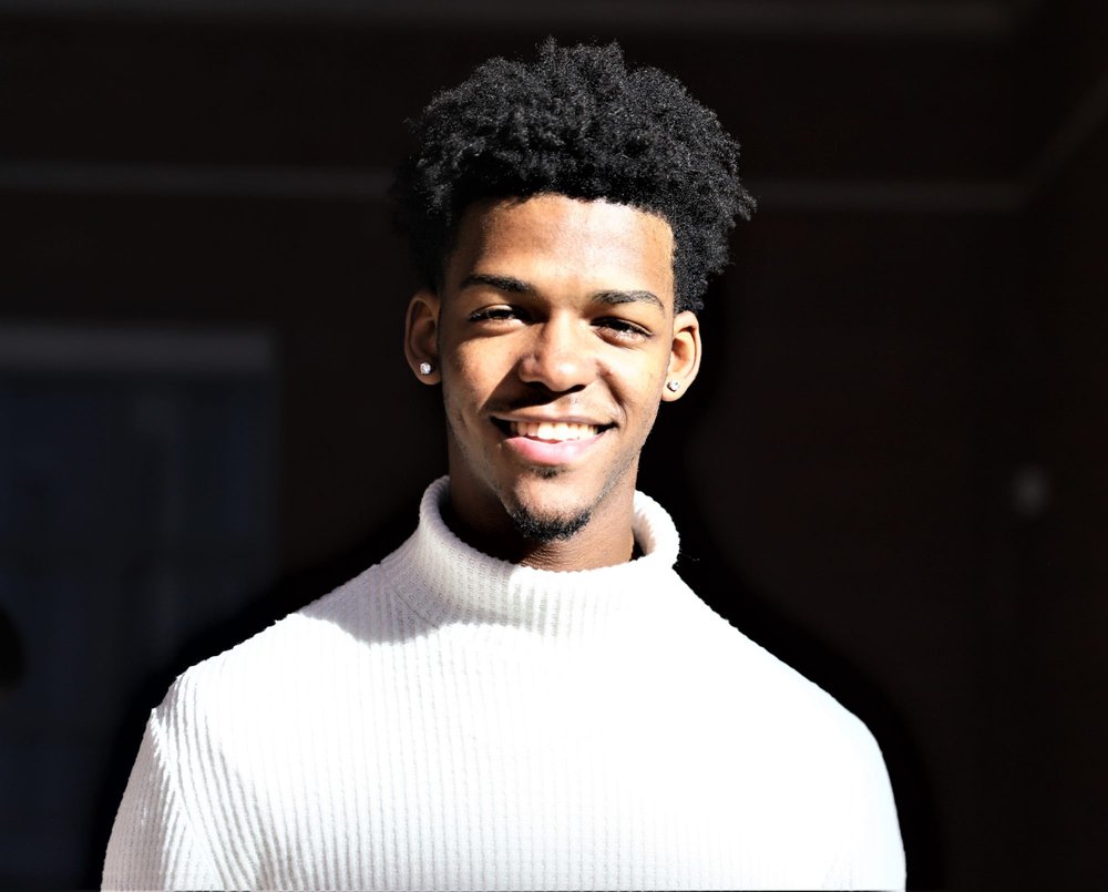 Student in a white turtleneck sweater