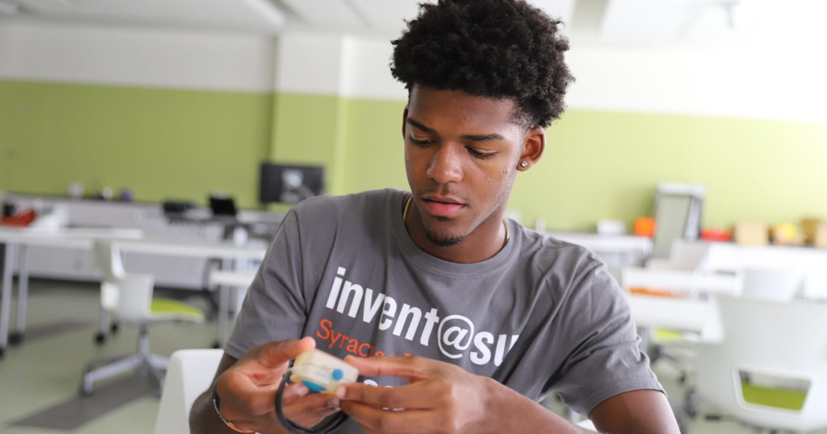 Russell holding his product