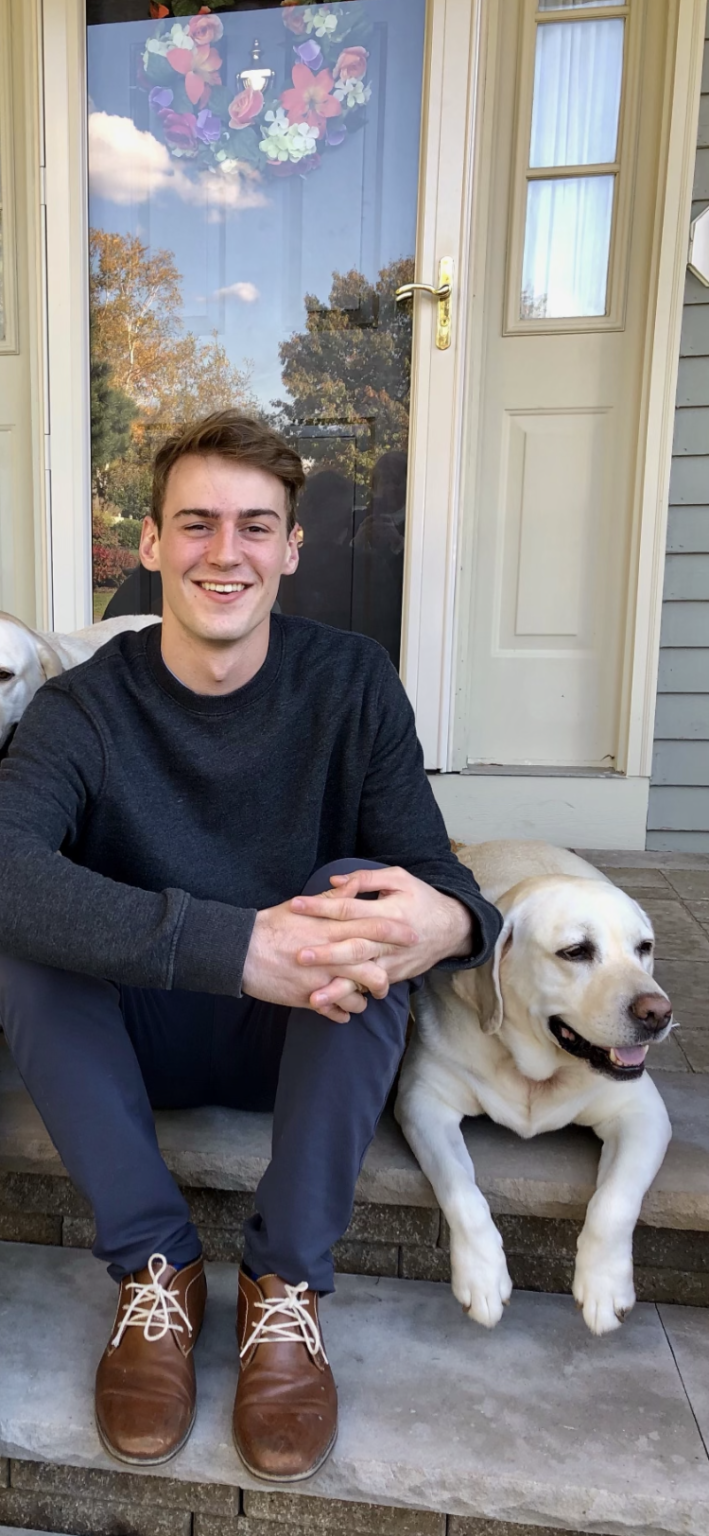 Ryan Ondocin sitting down with his dog