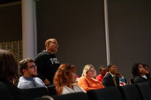 2022 Syracuse University’s National First Generation College Celebration featuring keynote speaker Dr. Evingerlean Hudson (center, standing) amidst audience participants