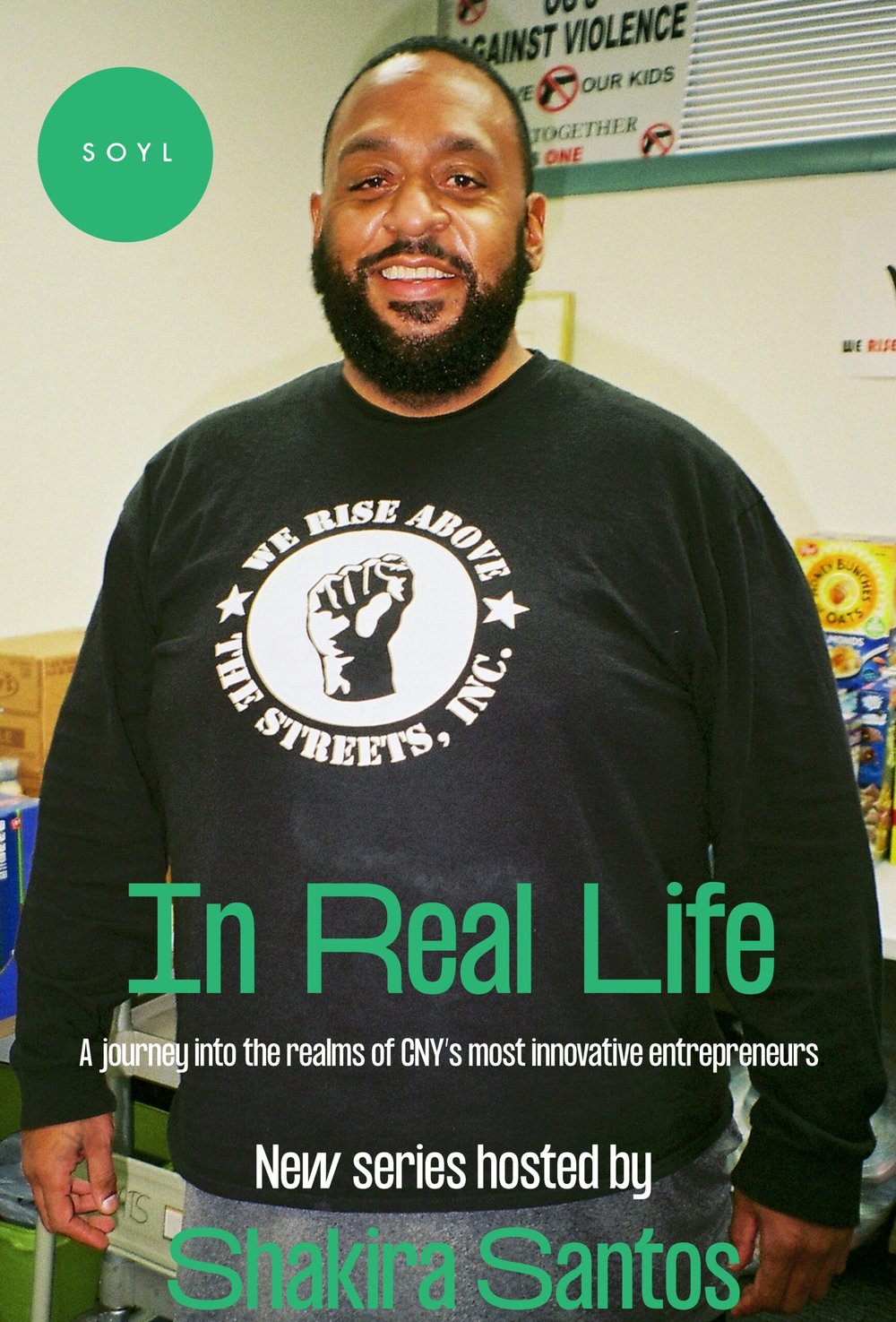 Black man wearing SOYL t-shirt and words In Real Life below