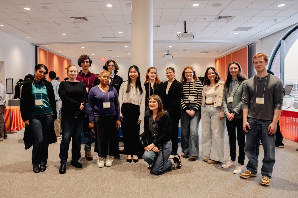 group of students in Spring 2025 cohort pose with SCRC librarians