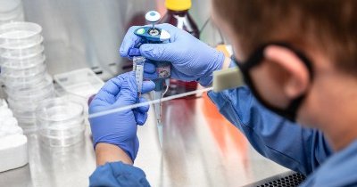 close up of someone working in a campus faculty lab