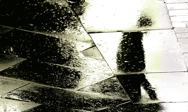 shadow of person on wet floor