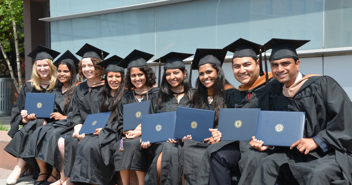 SU grad students in gown