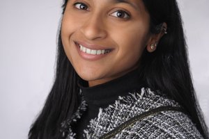 Sandhy Iyer poses for a professional headshot
