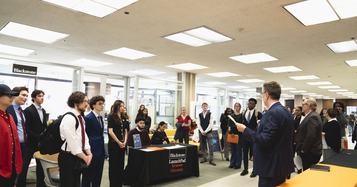 Scott Warren and Bruce Kingma welcome attendees in front of Blackstone LaunchPad Office