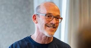 Man in a blockchain tee shirt