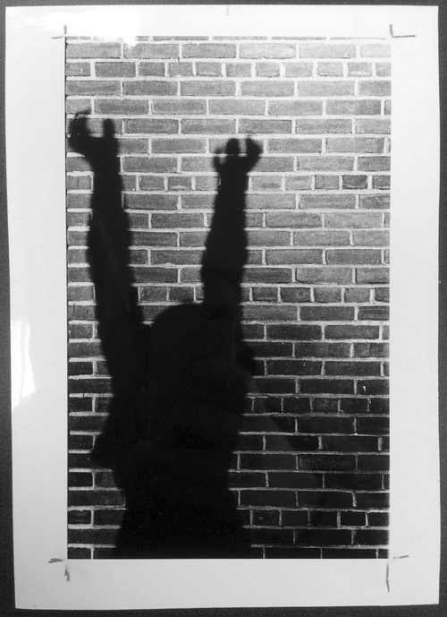 Shadow of Supplicant Persephone, sculpted by Ivan Mestrovic and cast in 1945, on the wall of Shafer Hall. Syracuse University Photograph Collection.