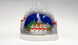 snow globe with mini people singing from a hymnal