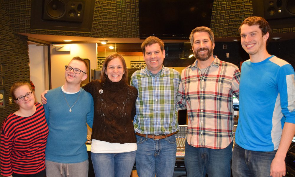 Sound Beat team: 6 people standing shoulder to shoulder, smiling and facing camera