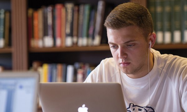 student studying with laptop
