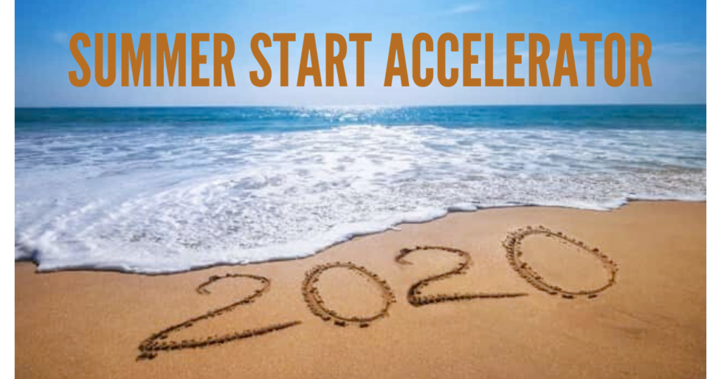 2020 written on the sand, ocean in the background