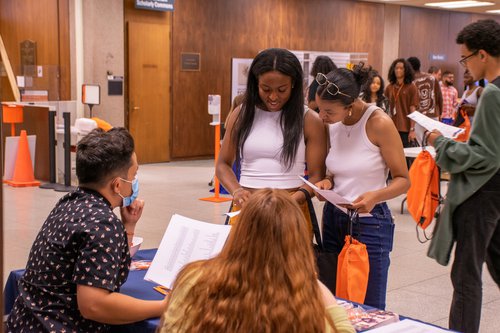 Summer Start 2022 students talking to representative from Special Collections Research Center