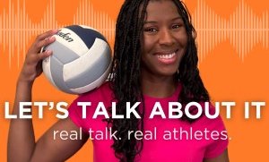 black woman holding volleyball