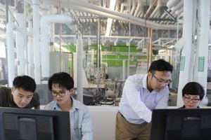 Researchers at the SyracuseCoE (taken pre-pandemic)
