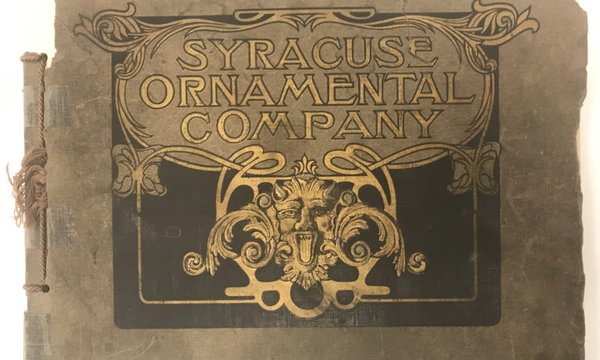 Gold lettering on tattered cover with words Syracuse Ornamental Company