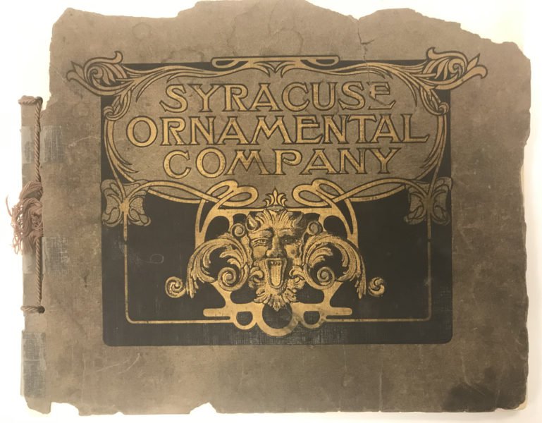 Gold lettering on tattered cover with words Syracuse Ornamental Company