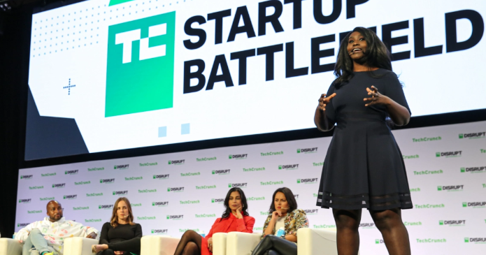 A woman speaking on stage at TechCrunch Disrupt