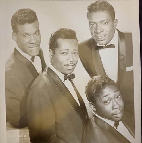 The Wanderers posing and looking upwards for a group photo. African Americans Musicians Photograph Collection.