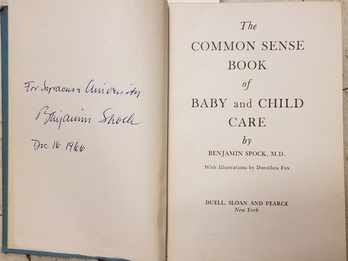 The inside cover of a first edition copy of The Common Sense Book of Baby and Child Care by Benjamin Spock. Dedicated “For Syracuse University. Benjamin Spock. Dec 16 1966.” Rare books.