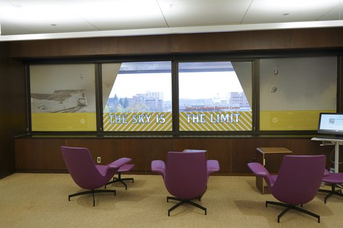 The windows in the Plastics Pioneers Reading Room read “The Sky Is The Limit” and mimic the viewpoint of a pilot in a plane.