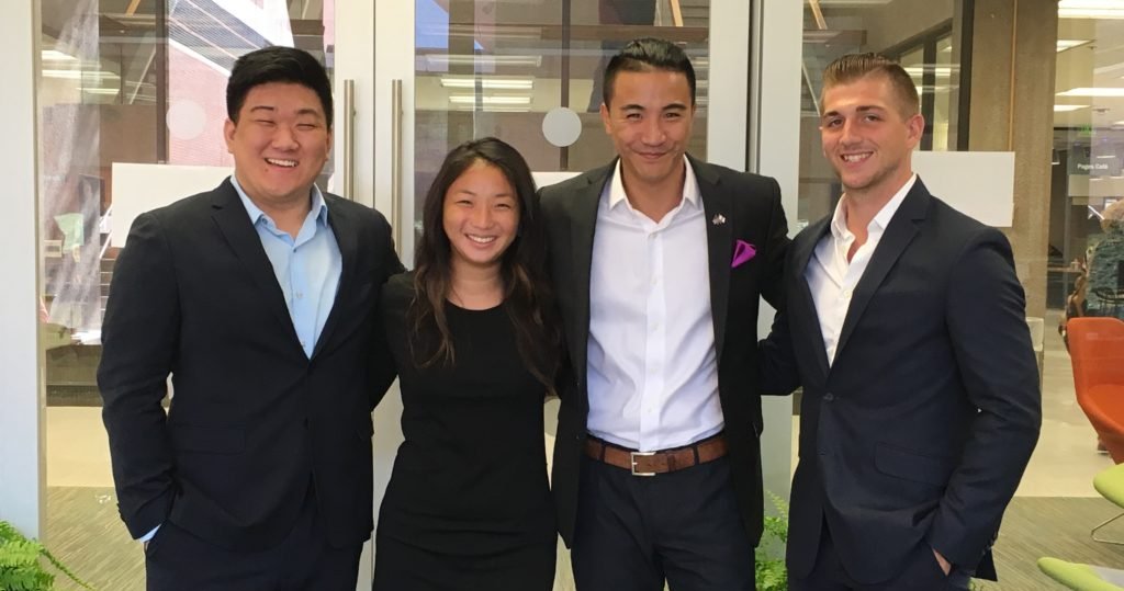 thrive team in business attire pose for a picture