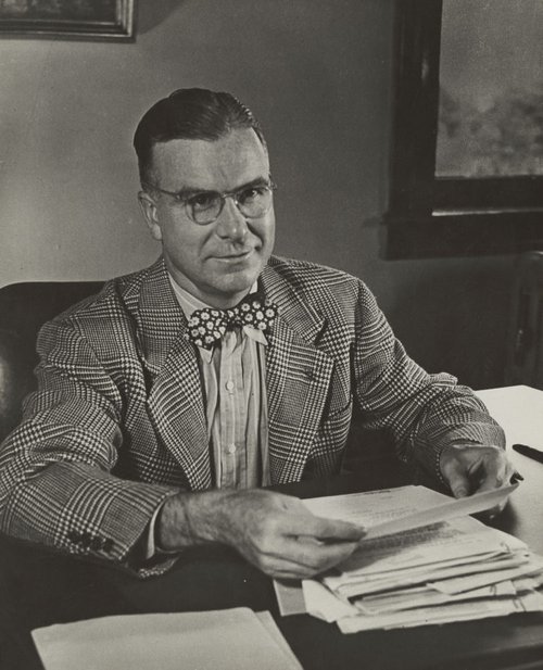 Chancellor Tolley at a desk.