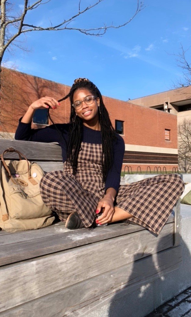 girl sitting on bench on Einhorn Walk
