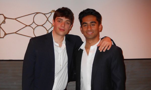 two young men standing side by side