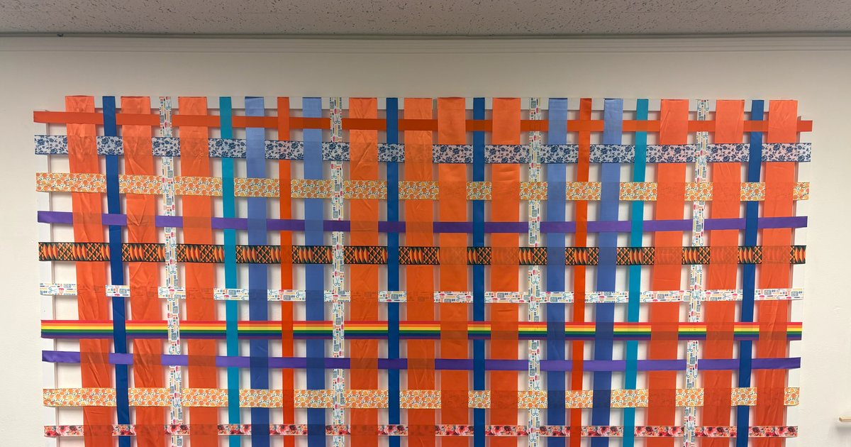 tapestry made of ribbons woven together
