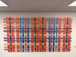 tapestry of colored ribbons woven together