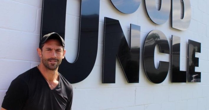 picture of Wiley Cerilli in front of Good Uncle sign