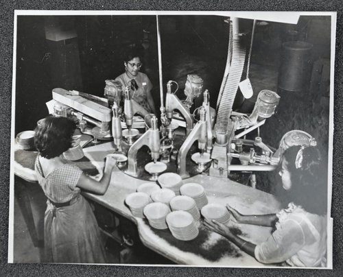 Workers operate a semi-automatic finishing machine inside the Branchell factory, Bayámon, Puerto Rico. Edward Hellmich Papers.