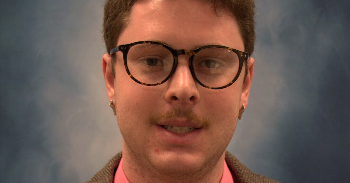 Zach Goldstein in professional attire poses for a photo