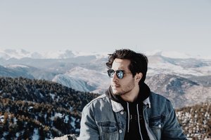 student standing against mountains