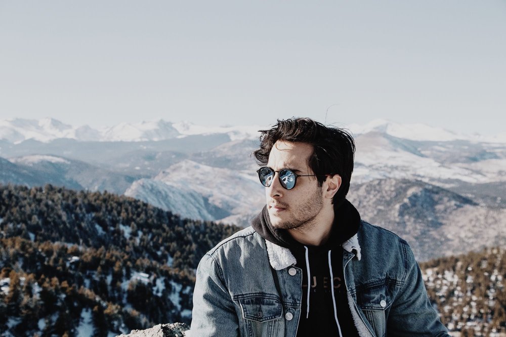 student standing against mountains