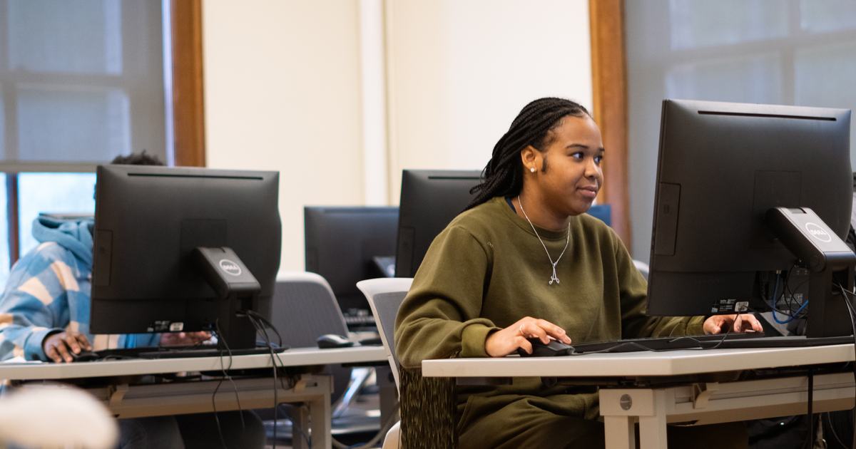 student using desktop computer